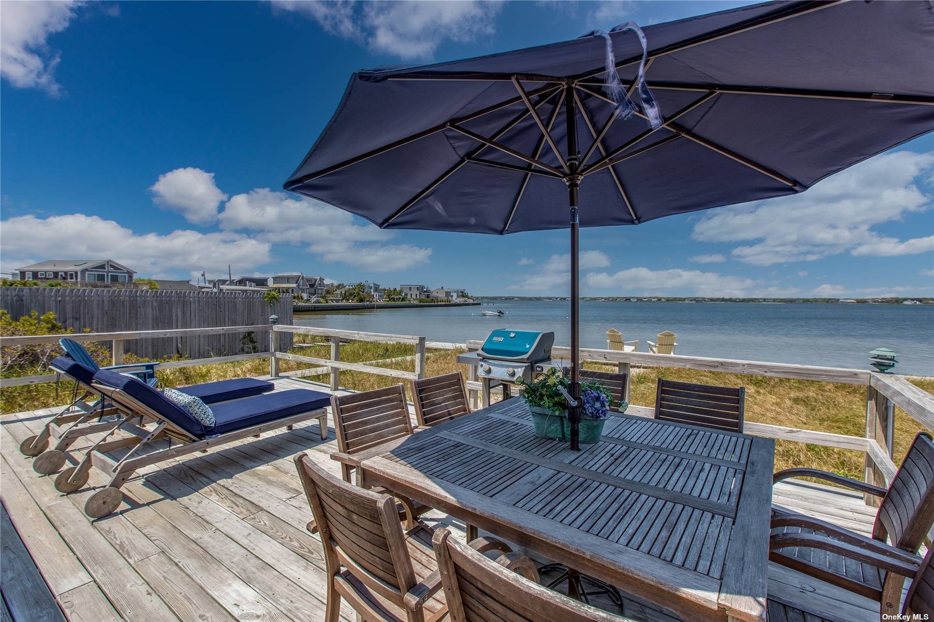 Relax and enjoy your vacation at a quintessential bayfront beachouse directly across the street from one of the most beautiful ocean beaches on LI.