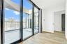 Entryway featuring a wall of windows and wood finished floors