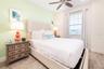Bright bedroom with soft tones and natural light in Kissimmee Florida near Disney