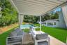 View of patio featuring outdoor lounge area and an outbuilding