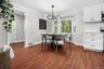 Charming dining nook with a modern chandelier and scenic window views, creating a warm setting for everyday meals or entertaining.