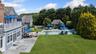 Outdoor pool featuring fence, an outbuilding, a yard, and a patio