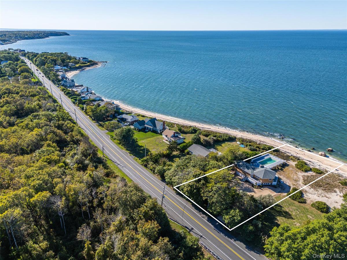 View of property location featuring property parcel outlined and a nearby body of water
