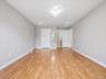 ANOTHER VIEW OF PRIMARY BEDROOM W/ VIEW OF BATH