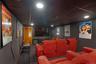 Home theater with a drop ceiling, carpet floors, and recessed lighting