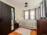 Bedroom # 3 Warm wood flooring complementing a crisp white wall palette