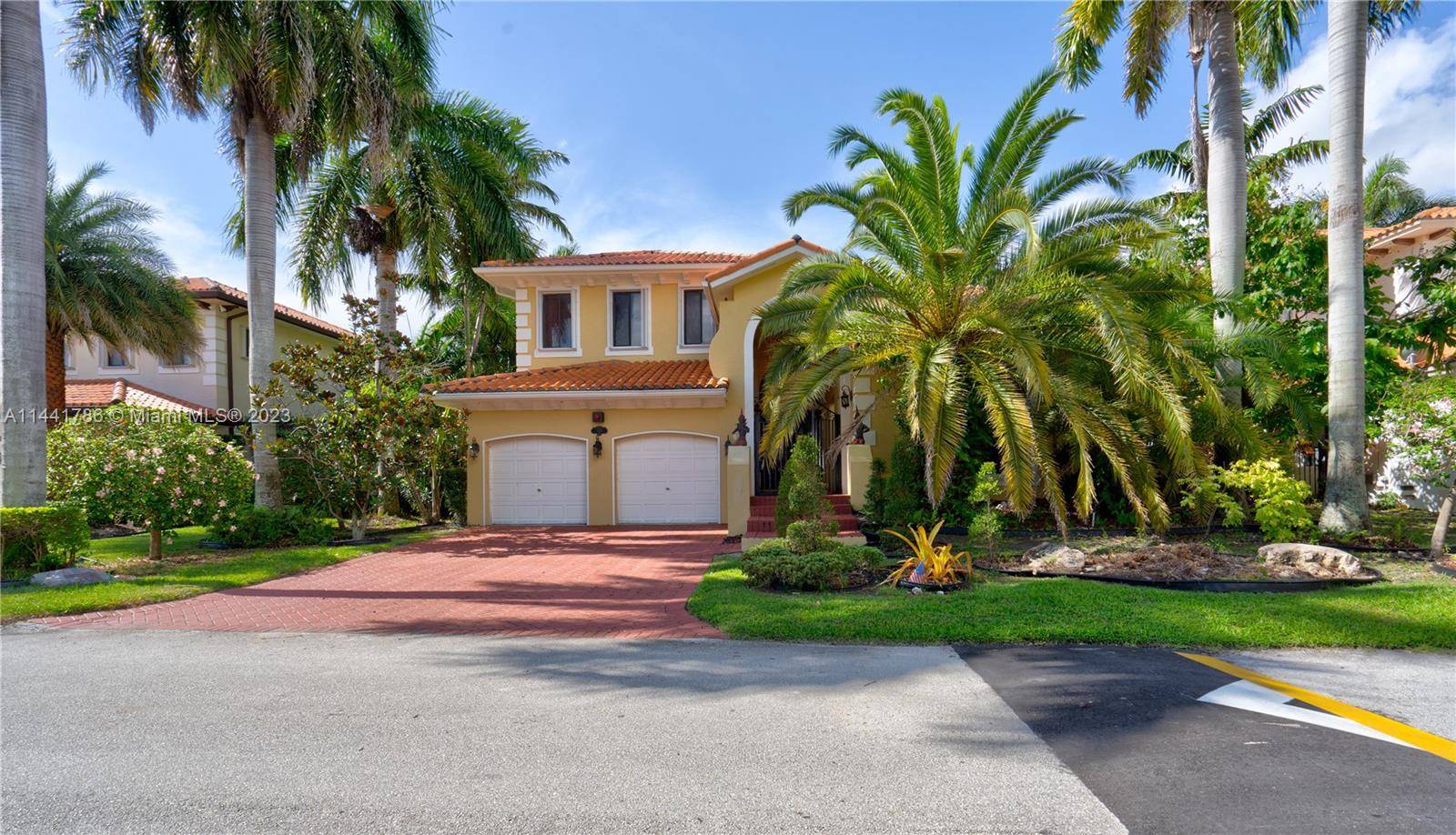 PRESENTING This 5 Bedroom 4 1 2 Bath COURTYARD STYLE Home in the Cutler Cay Gated Community.