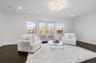 Sitting room featuring recessed lighting, dark wood finished floors, and french doors