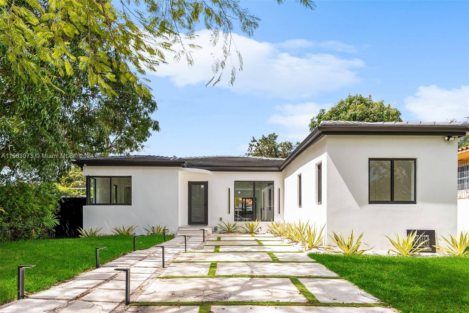 Welcome to your impeccably remodeled oasis in the coveted Roads neighborhood of Brickell !