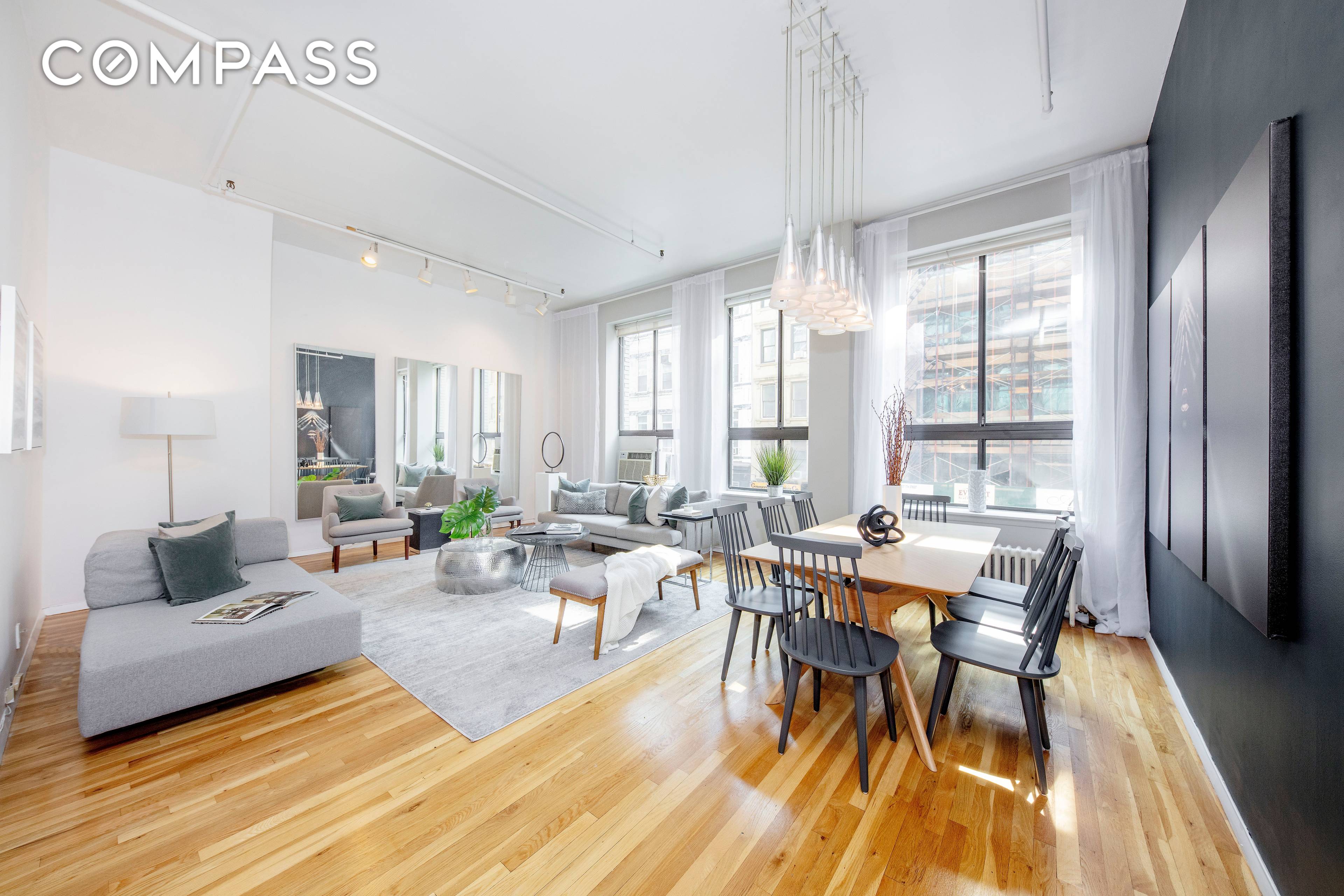 Sunny, south facing loft with 11FT ceilings and oversized windows in the boutique Brooks Van Horn Condominium, a converted pre war warehouse in prime Chelsea.