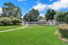 Back Yard offers a private retreat surrounded by lush, professionally landscaped grounds