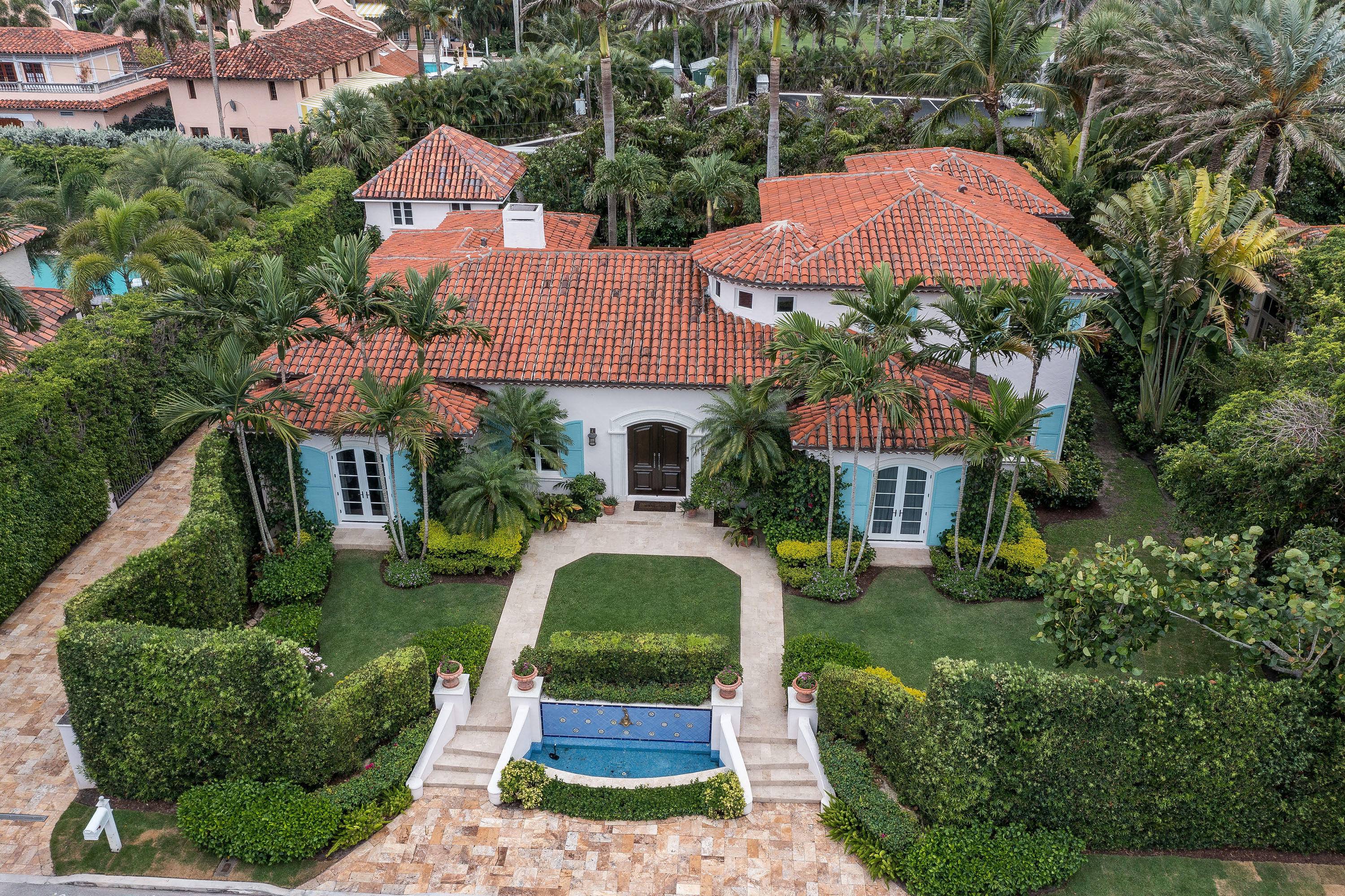 Enjoy this beautiful mediterranean 4BR 5BA home with 1BR 1BA carriage house in the Estate Section with waived Mar a Lago initiation fees.