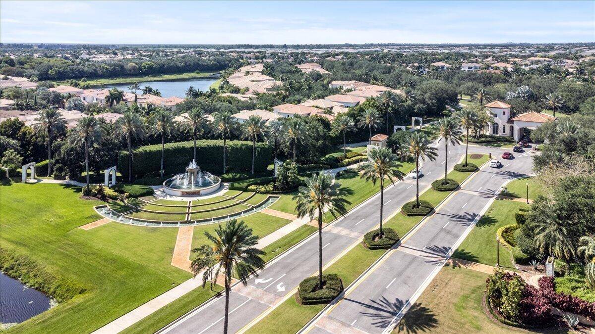 Spectacular estate home in the highly sought after gated The Oaks at Boca.