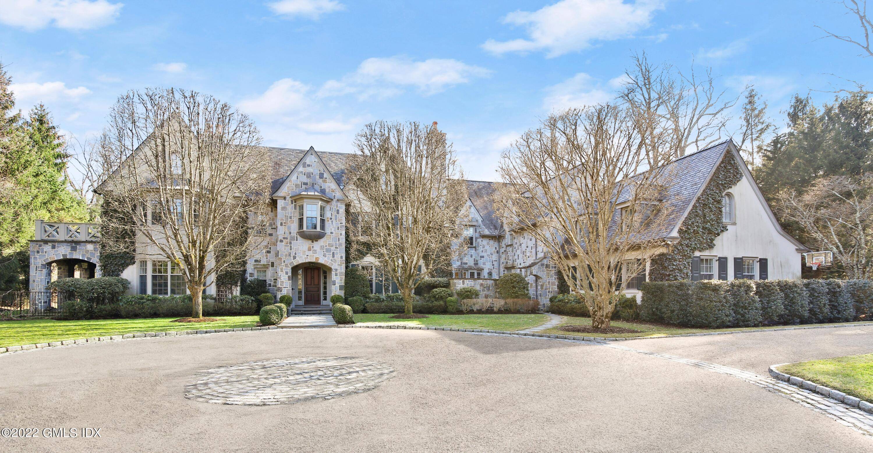 Stone manor built by Aberdeen Properties and tastefully expanded and customized by the owners.