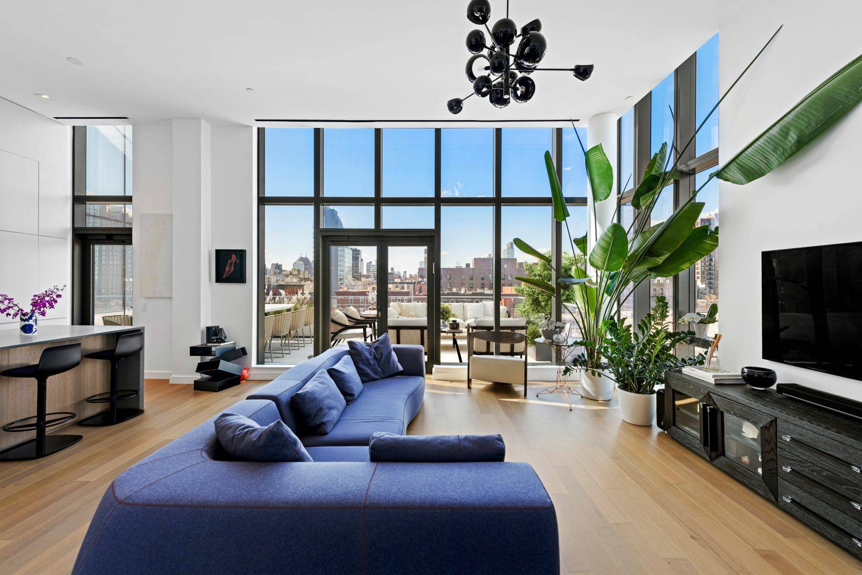 Modern craftsmanship and high end luxury come together in this stunning corner penthouse in the heart of the Lower East Side, a 3 bedroom, 3 bathroom condo boasting a pair ...