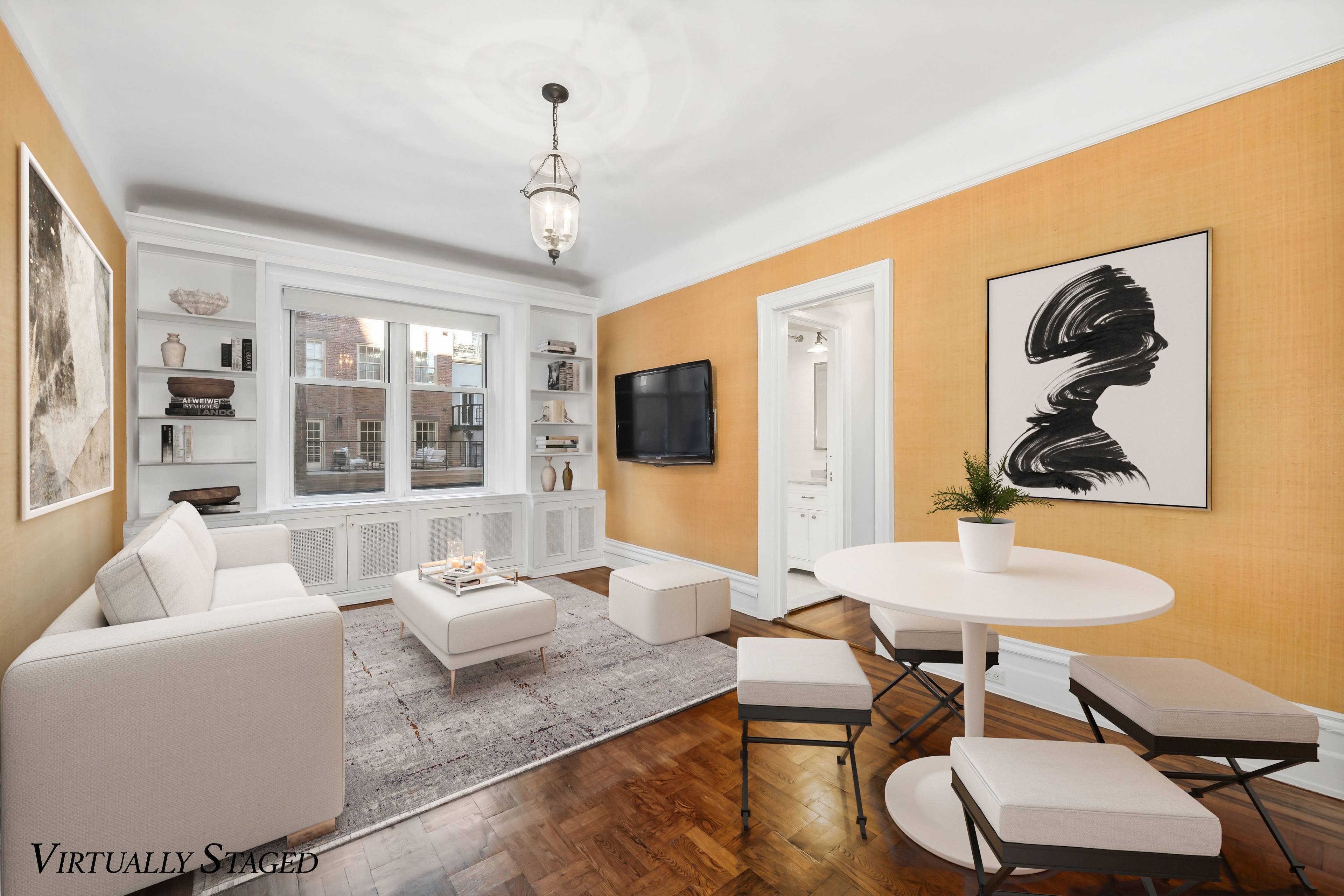 BACK ON THE MARKET ! ! Enter this fabulous prewar apartment through an oversized entrance hall with grand 10 foot ceilings.