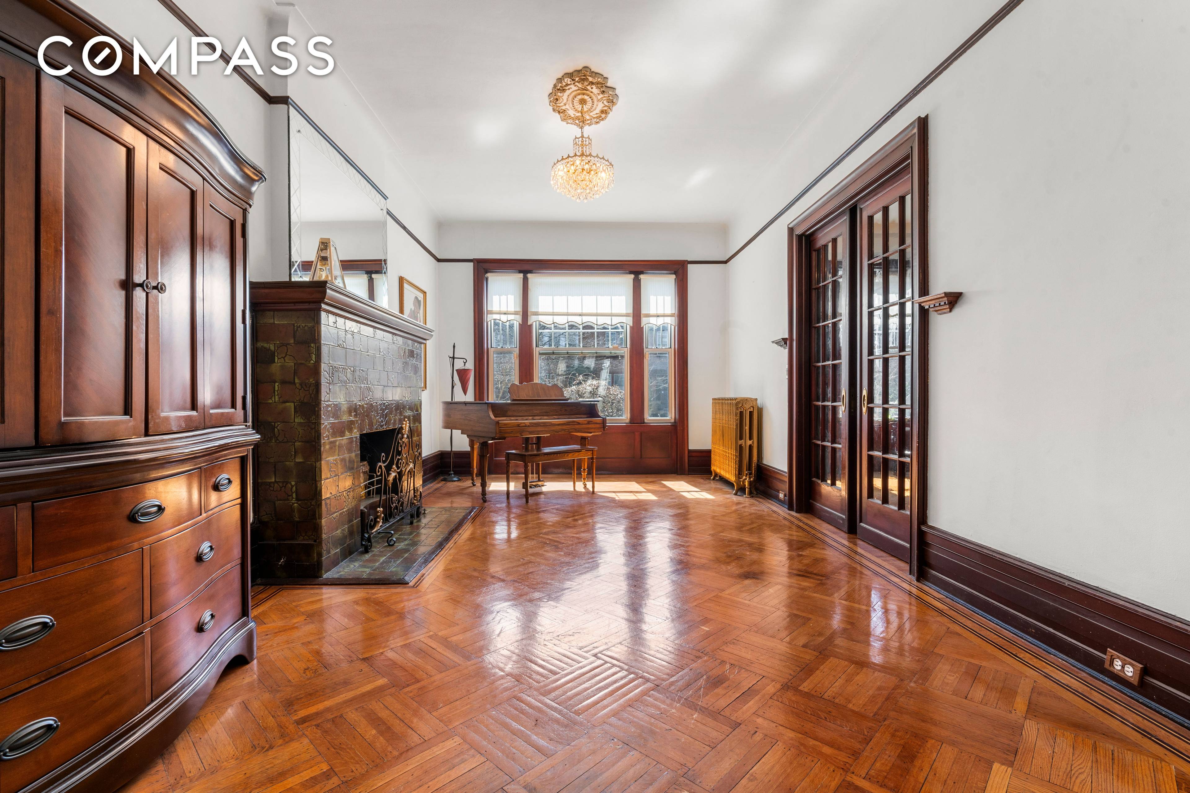 Nestled within the picturesque charm of a tree lined Crown Heights block, this captivating cottage style home exudes the quaint appeal of a bygone era.