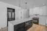 Thoughtfully designed kitchen featuring clean finishes, modern cabinetry, and an open layout that connects seamlessly to the dining area and main livi
