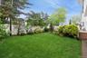 View of yard with a wooden deck