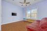 Bedroom featuring light wood-type flooring, a ceiling fan, and recessed lighting