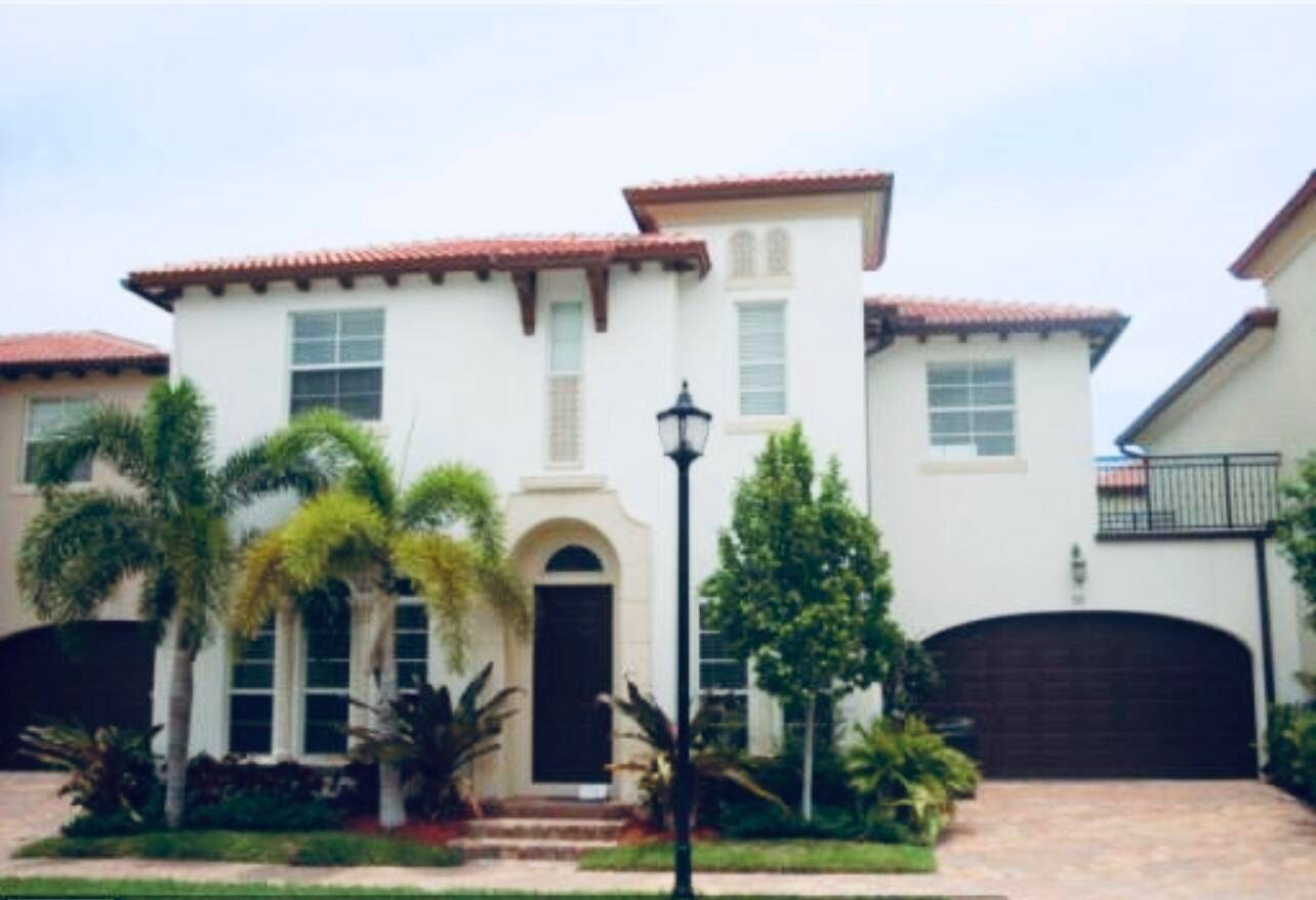 FURNISHED or UNFURNISHED Old Spanish style home in Boca Raton is ideally located near beaches in gated community with resort style pool.