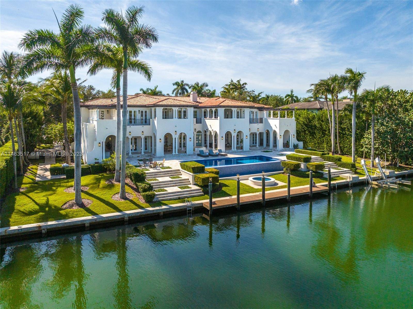 This breathtaking California Modern Spanish WATERFRONT home is in the highly desirable GATED community of GABLES ESTATES.
