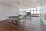 Rec room featuring expansive windows and dark hardwood / wood-style floors