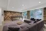 Designed for year-round enjoyment, this remarkable recreation room offers exceptional scale, original stone walls rich with character, and oversized s