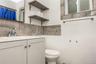 Bathroom with vanity, backsplash, and a shower with curtain