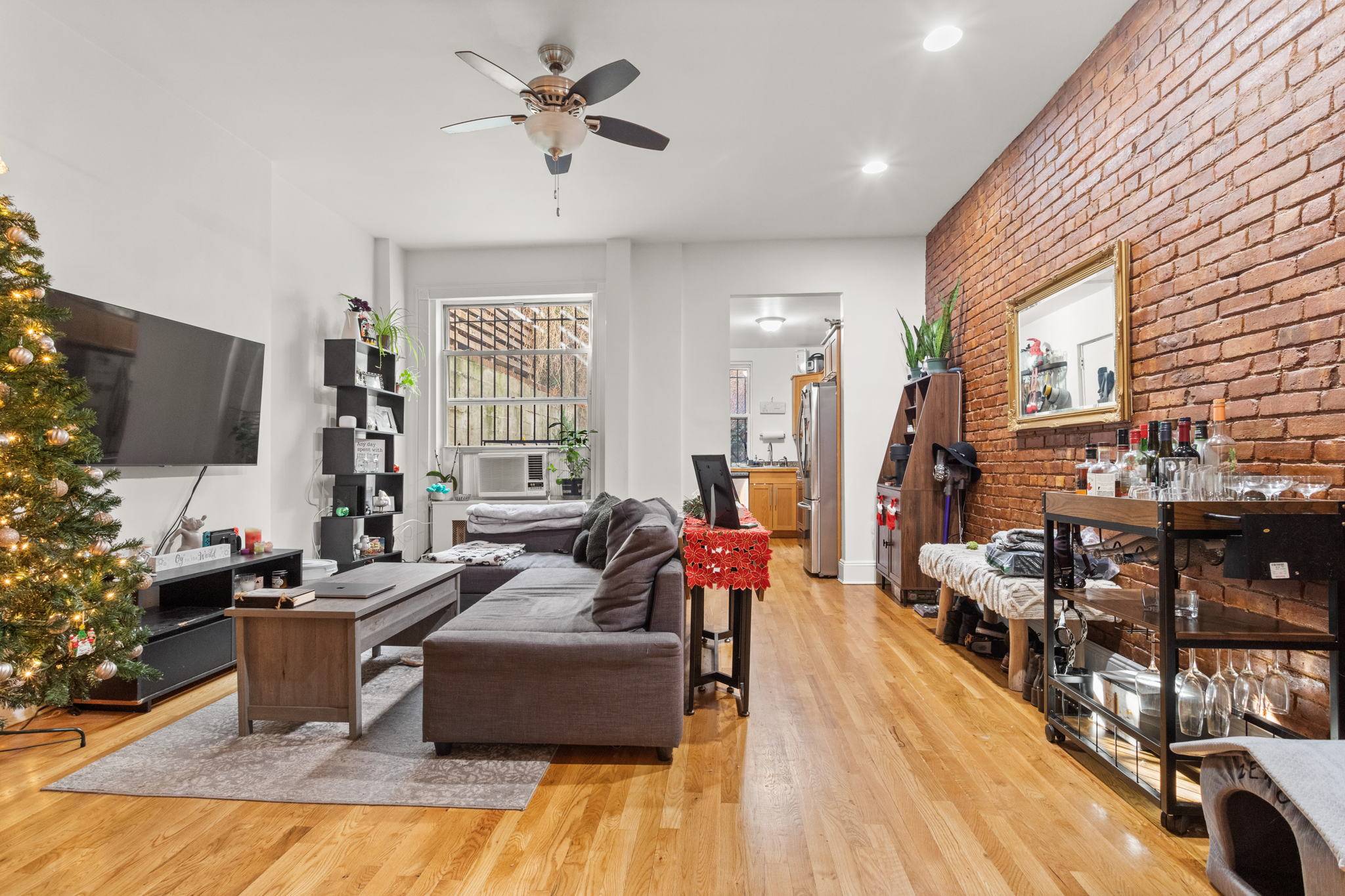 Freshly Gut Renovation ! Exposed Brick Detail, Fresh hardwood floors, Faux fire place, Modern Kitchen with Stainless Steel Appliances, Sun Bright Double Pane Windows, Ceiling Fan, True Spaced Closet, Vaulted ...
