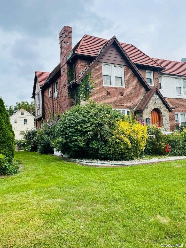 This stunning and immaculate home welcomes you to a beautifully manicured front lawn and patio for relaxation all while enjoying the nature of Cambria Heights.