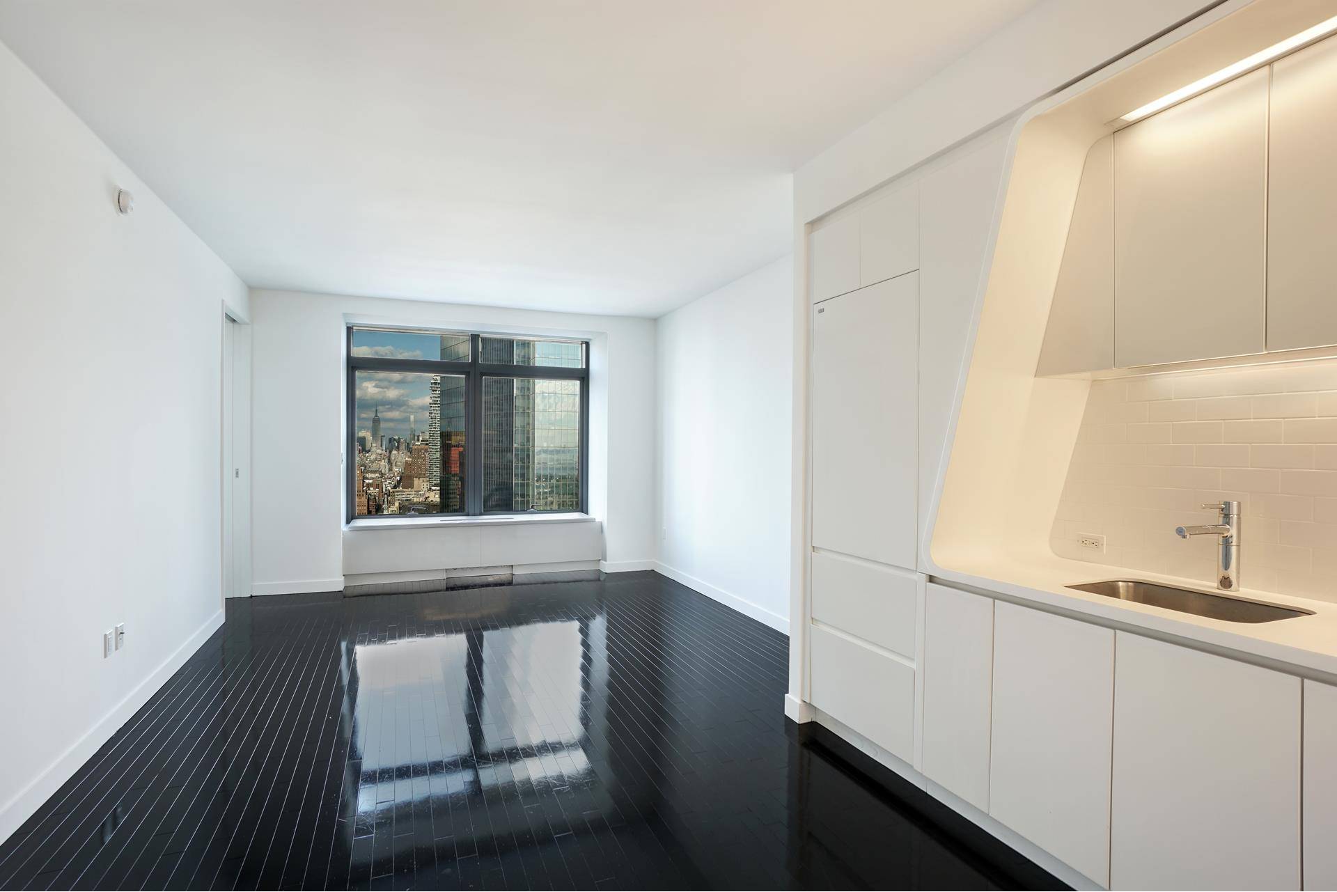 Impeccably styled one bedroom apartment on a high floor with stunning northern views of NYC's skyline, 9 11 Memorial Park, Statue of Liberty, and beyond.
