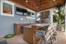 Mid level back porch with outdoor kitchen