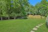 Wide open lawn space provides endless opportunities for play, recreation, and enjoying the peaceful setting.