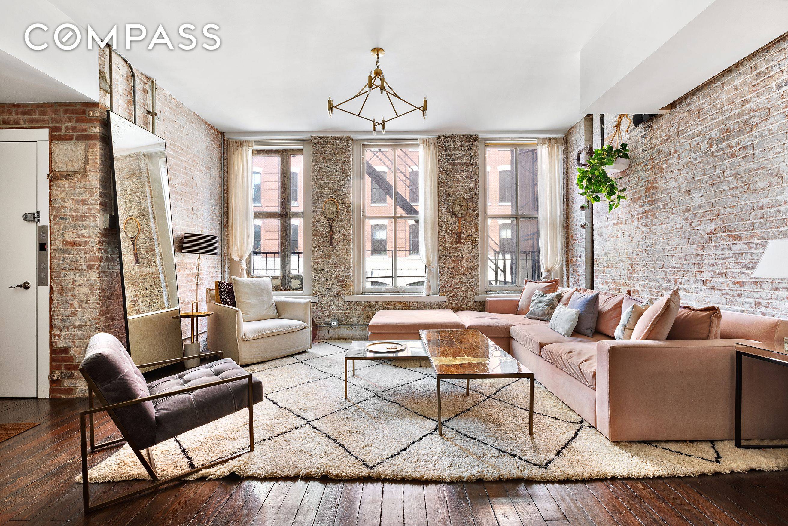 Spectacular original details meet chic designer style in this beautifully renovated two bedroom loft with large den and two bathrooms in a historic Tribeca boutique cooperative.