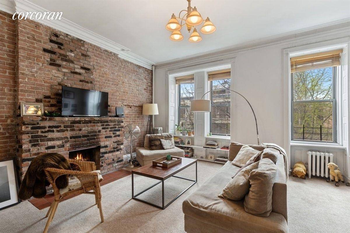 This bright and spacious Duplex occupies the top two floors of an owner occupied brownstone on a quiet tree lined block.