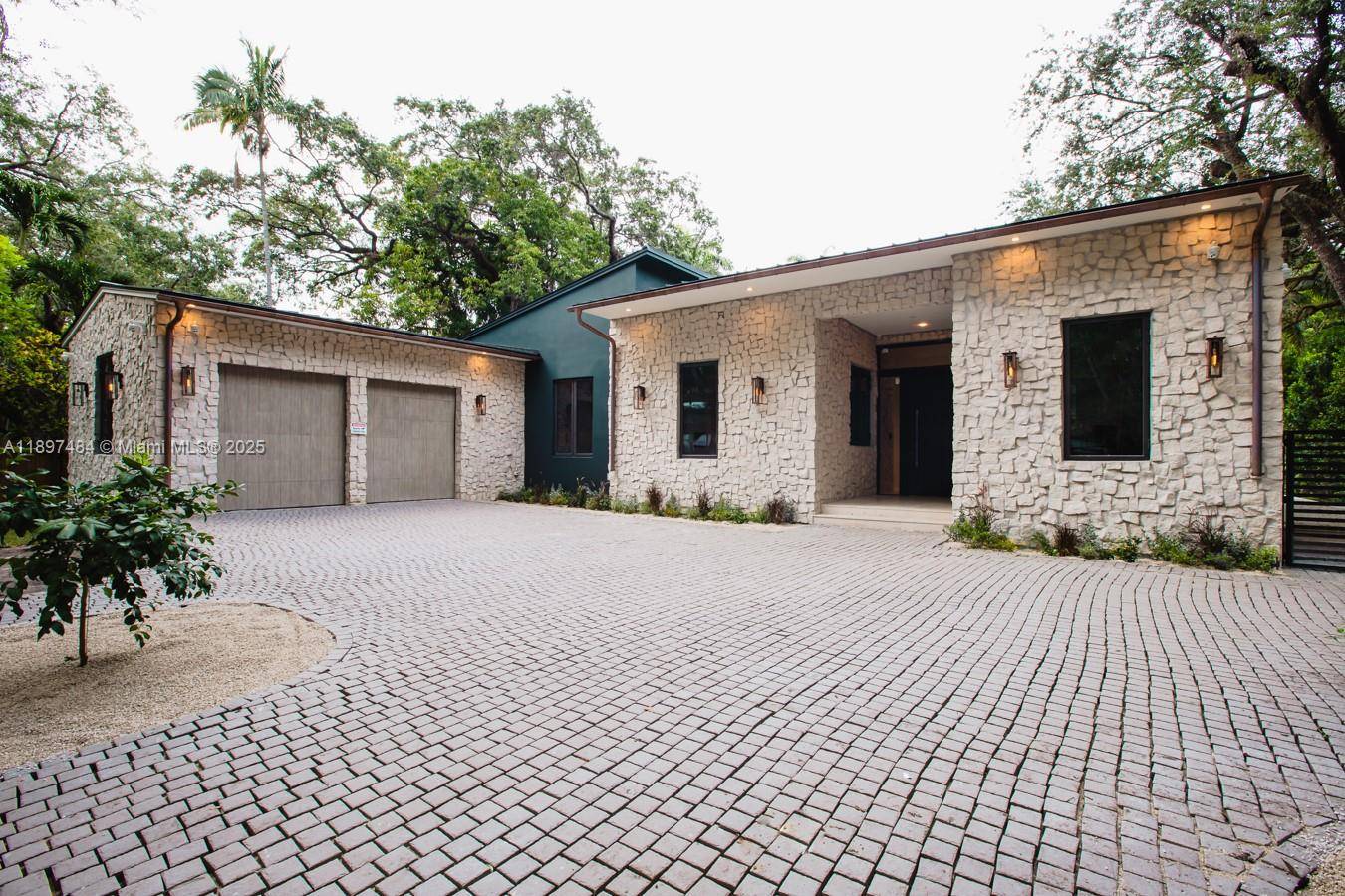 This Luxurious 2023 one story Estate in North Coconut Grove offers Resort style living with an unparalleled eye for detail !