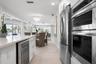 Breakfast bar island with wet bar and beverage fridge