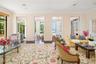 The formal living room is next to the library and the gathering room and flows nicely to and from. The separation is an option and their are doors ar