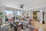 Marble flooring, water views, floor to ceiling glass, crown molding. Bright open and airy.