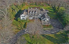 Located in the lovely Greenwich estate area, this classic stone and clapboard Georgian Colonial is behind stately gates ; and has a beautifully landscaped and private setting.