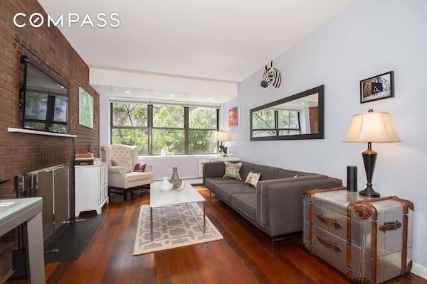 Newly renovated south facing one bedroom with wood burning fireplace.