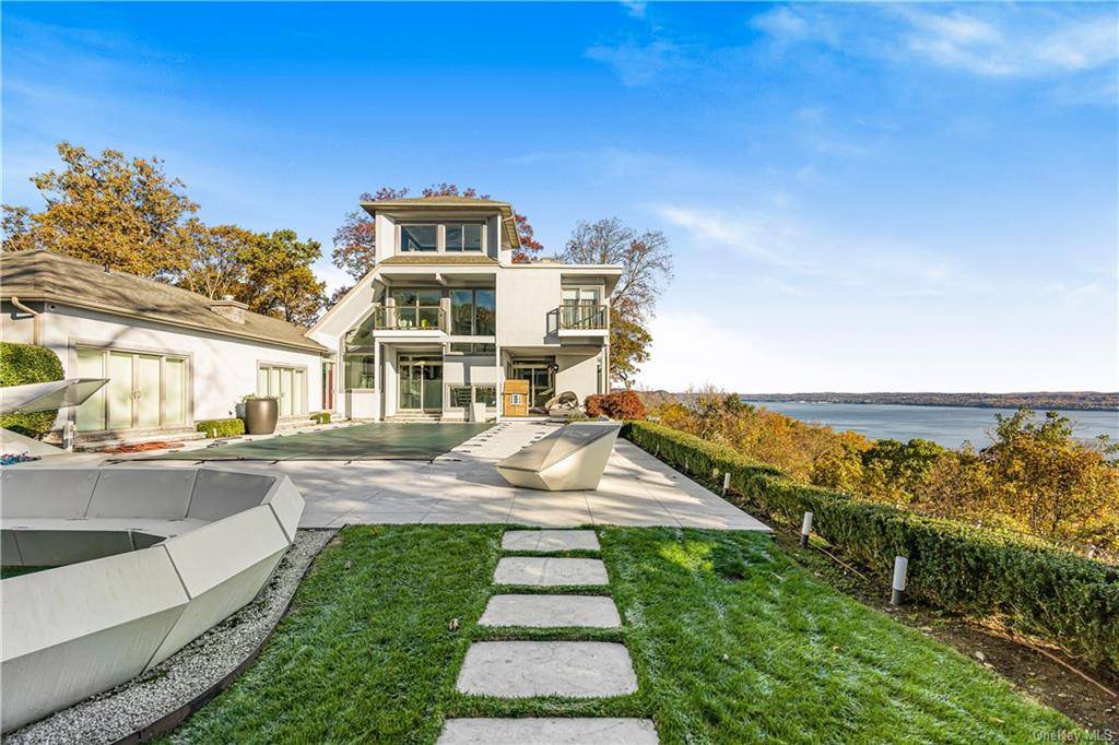 Experience the epitome of modern luxury living at this stunning home on Tweed Blvd in Nyack, NY with breathtaking Hudson River views.