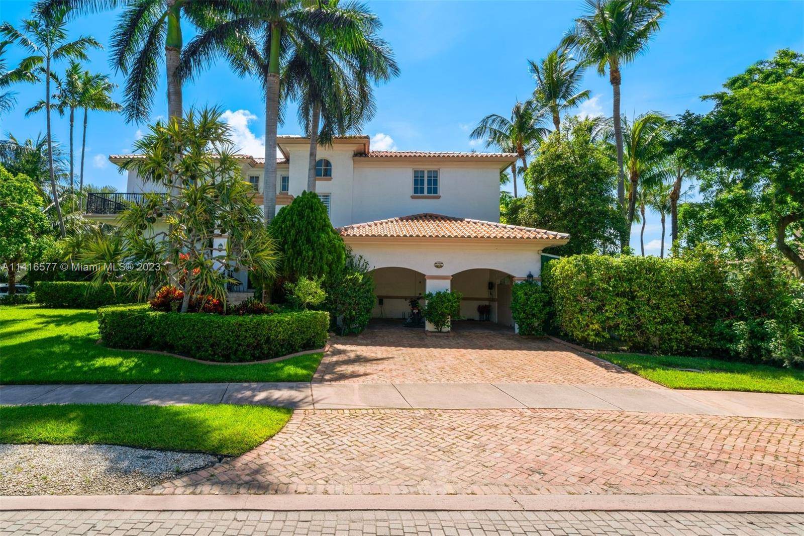 Stunning residence that boasts an enviable location with an oversized corner lot of 9, 000 Sq Ft on the most desirable street, Harbor Drive.