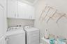Laundry Room Featuring Built-In Cabinetry for Additional Storage