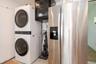 Laundry area with stacked washer / drying machine