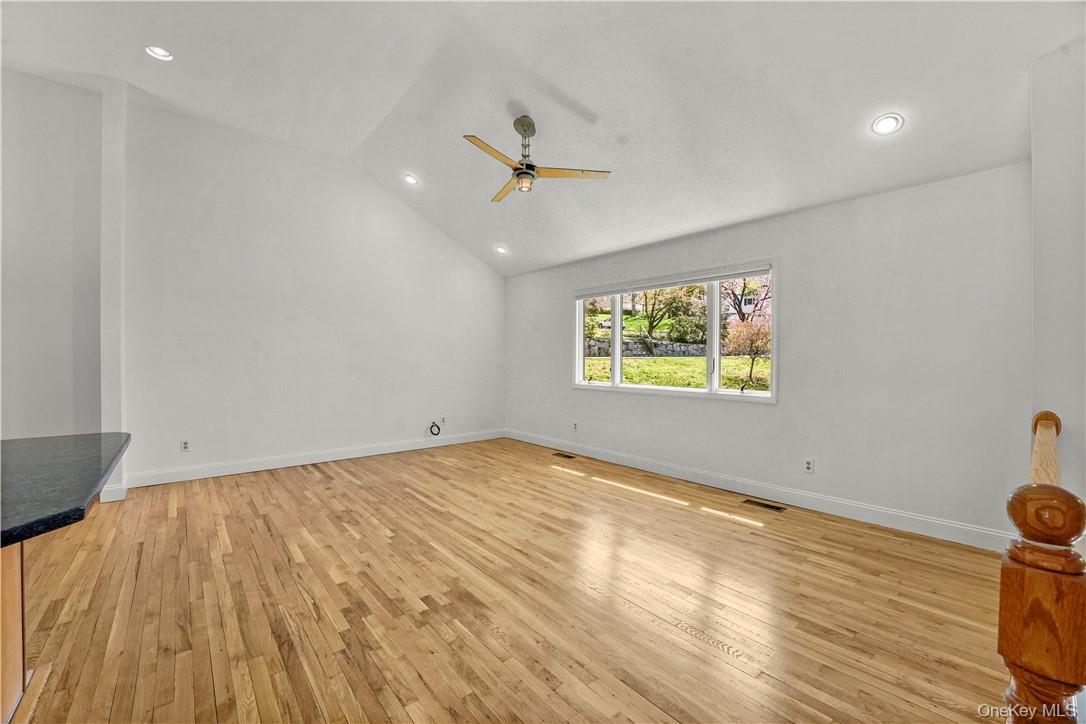 Living Room with Cathedral Ceiling. Kitchen on the left.