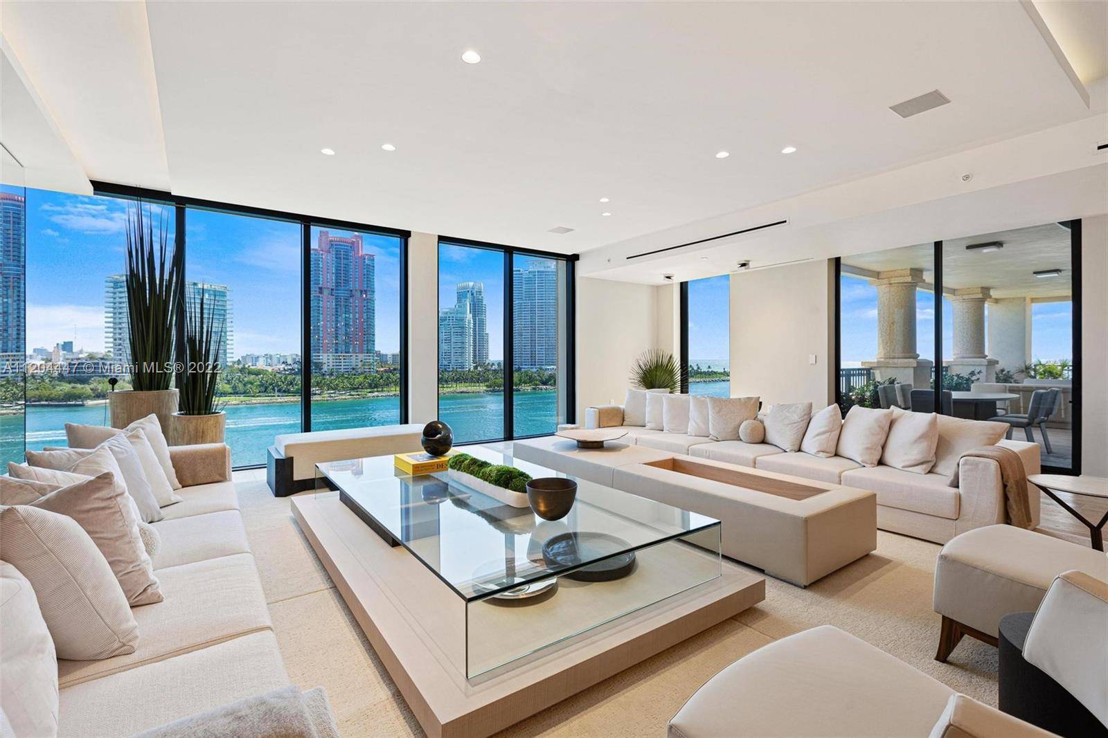 BESPOKE RESIDENCE DESIGNED BY POGGI DESIGN IN NEUTRAL TONES OF BEIGE WITH DIRECT BAY VIEWS AT THE AWARD WINNING PALAZZO DELLA LUNA ON FISHER ISLAND !