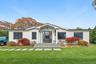 View of front of home featuring a front lawn