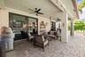 Your 300 sq ft roofed, shady back patio with plenty of room for the BBQ, outdoor sofa/chairs, a 4-chair hightop and a hammock